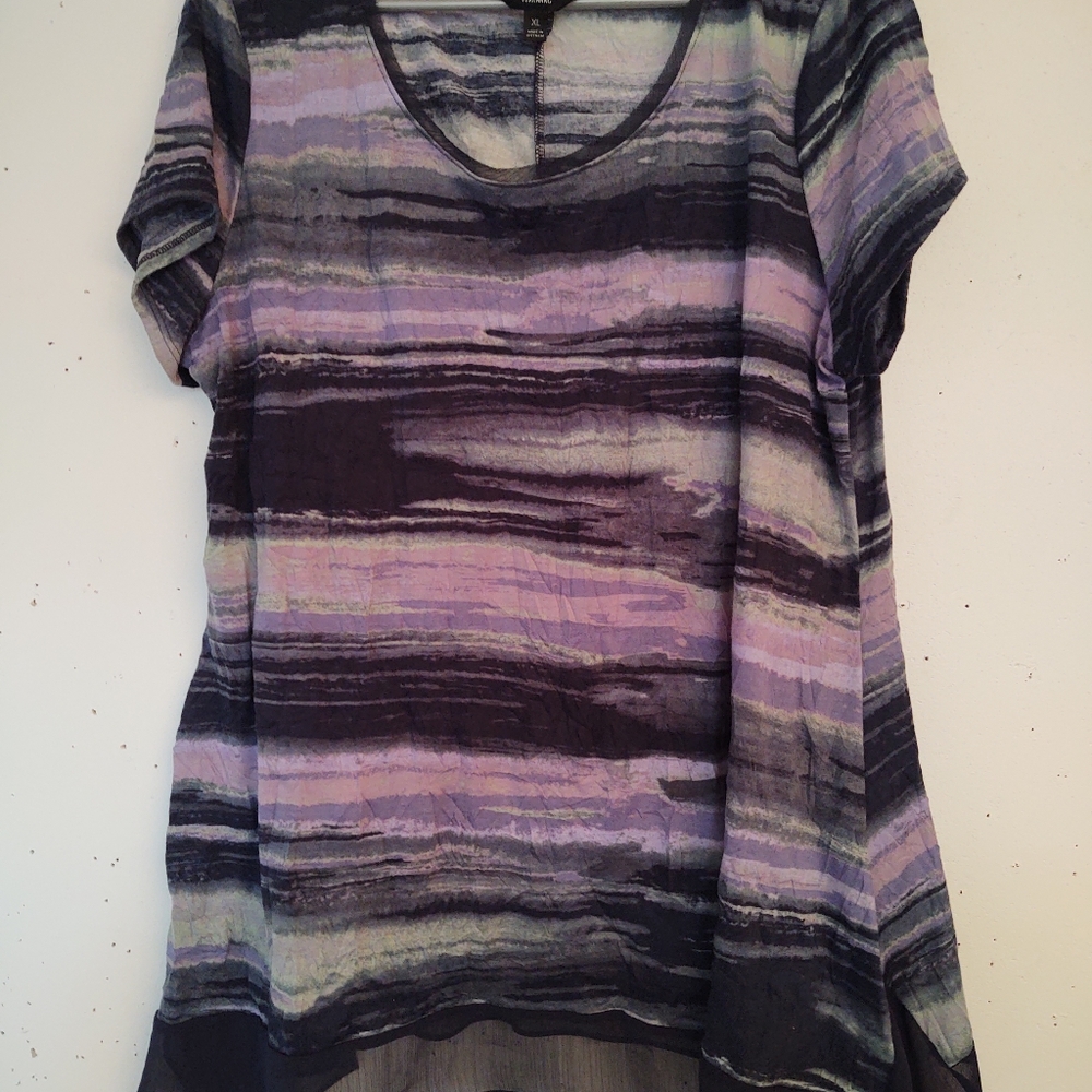 Multicolored crinkle top with asymmetrical hemline with a layered look. So cute!
